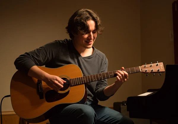 A musician playing confidently with impeccable rhythm