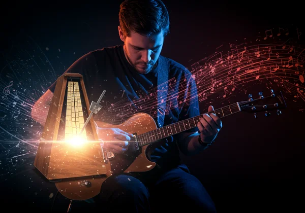 Musician with metronome, mastering complex rhythms